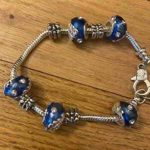 Silver Charm Bracelet with Diamond studded Blue and Silver Beads.